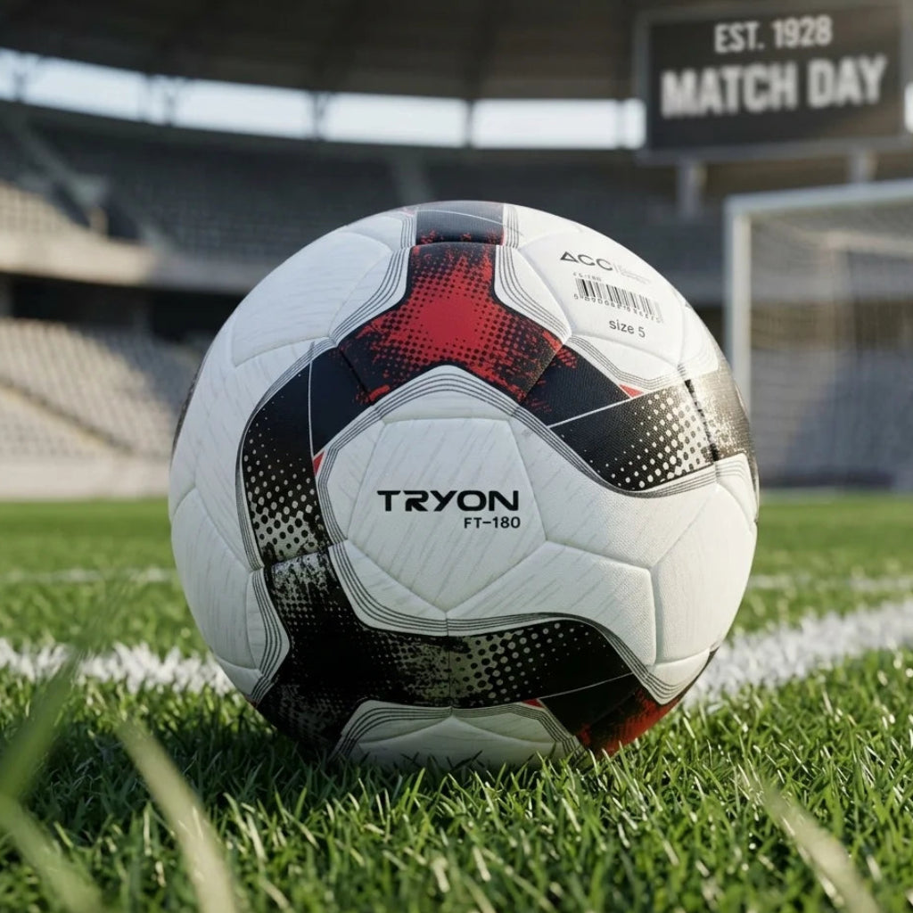 Soccer ball with 'Tryon' branding on a grass field, likely in a stadium setting.